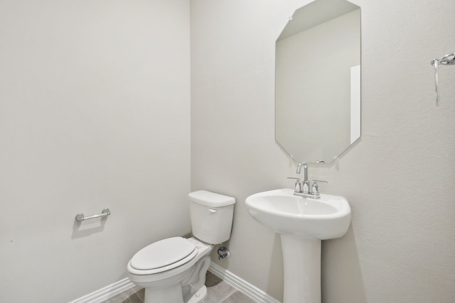 bathroom with toilet and sink