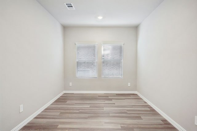 unfurnished room featuring light hardwood / wood-style flooring