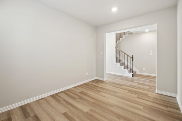 spare room with light wood-type flooring