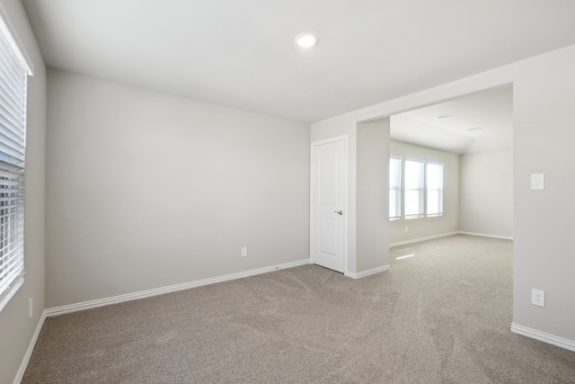 spare room with light carpet