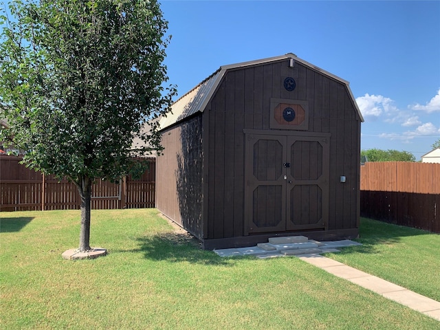 view of outbuilding with a lawn