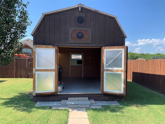 view of outdoor structure featuring a yard