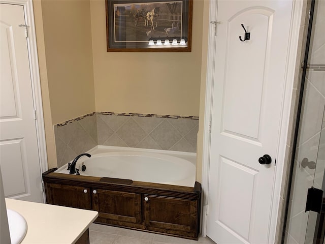 bathroom with vanity and a bath