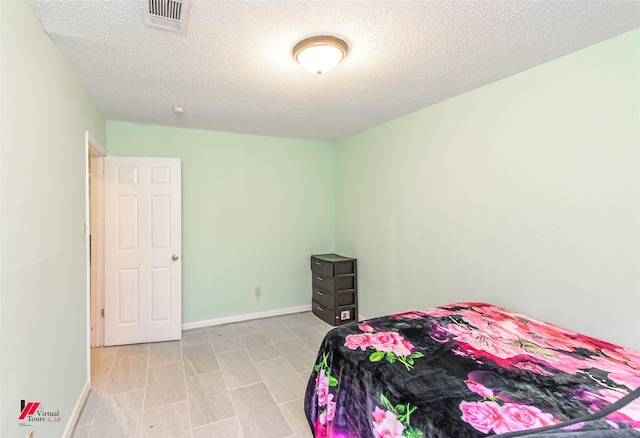 bedroom with a textured ceiling