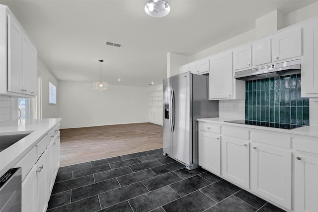 kitchen with pendant lighting, stainless steel fridge with ice dispenser, and white cabinets