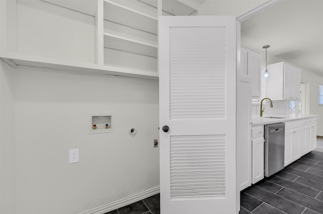 washroom featuring hookup for a washing machine, electric dryer hookup, and sink