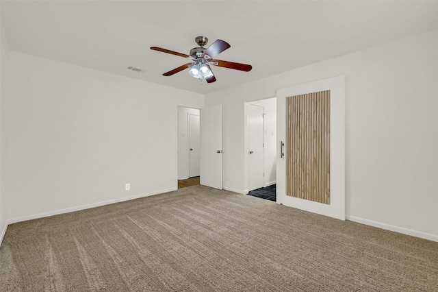 unfurnished bedroom featuring ceiling fan and carpet flooring