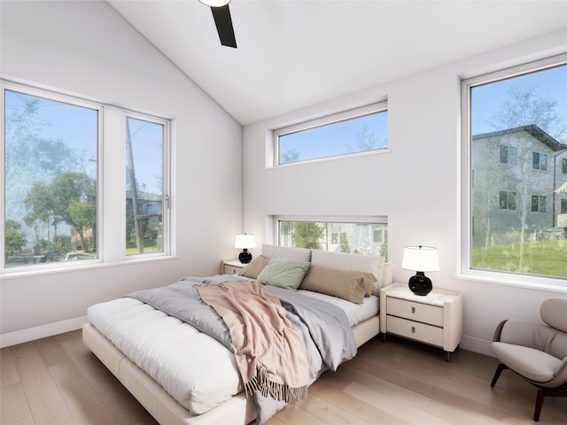 bedroom with lofted ceiling, light hardwood / wood-style floors, and ceiling fan