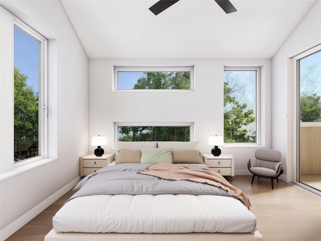 bedroom with lofted ceiling, access to exterior, hardwood / wood-style flooring, and ceiling fan