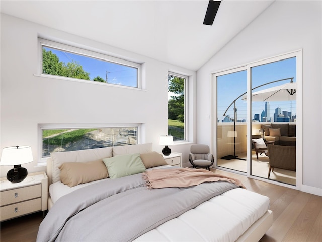 bedroom with lofted ceiling, hardwood / wood-style floors, access to outside, and ceiling fan