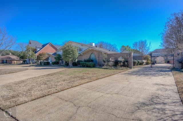 ranch-style home featuring a front yard