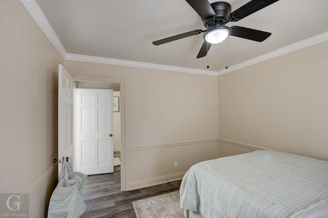 bedroom with ornamental molding, ceiling fan, and dark hardwood / wood-style flooring