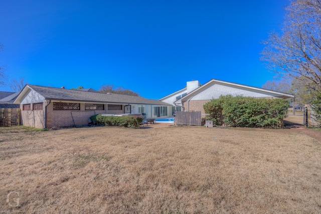 back of house with a yard