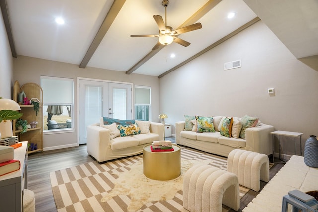 living room featuring vaulted ceiling with beams, hardwood / wood-style flooring, french doors, and ceiling fan