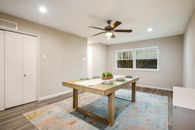 unfurnished dining area featuring ceiling fan and hardwood / wood-style floors