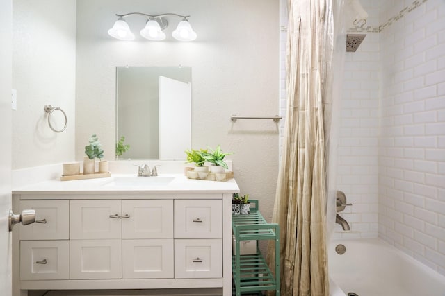 bathroom with vanity and shower / bath combo with shower curtain