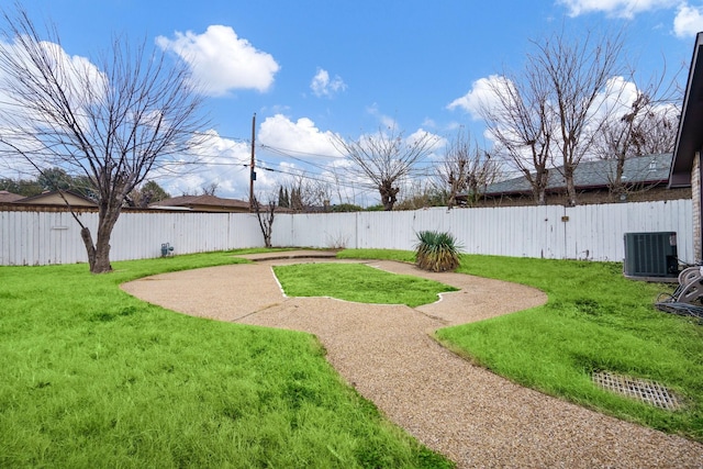 view of yard featuring central air condition unit