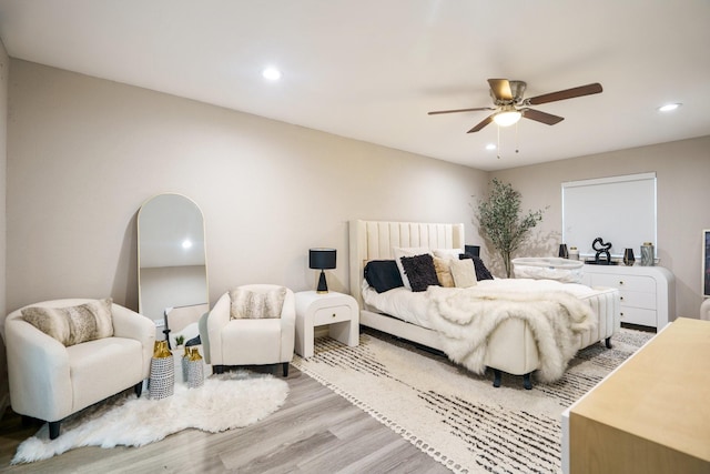 bedroom featuring light hardwood / wood-style floors and ceiling fan