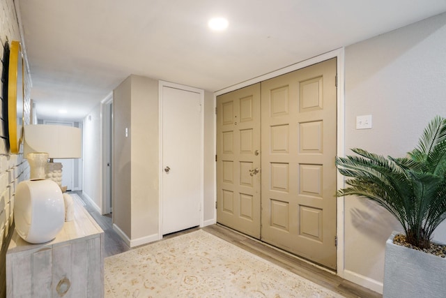 corridor featuring wood-type flooring