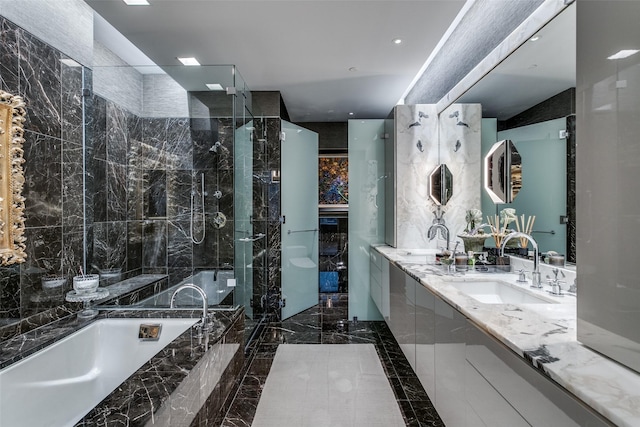 bathroom featuring vanity and separate shower and tub