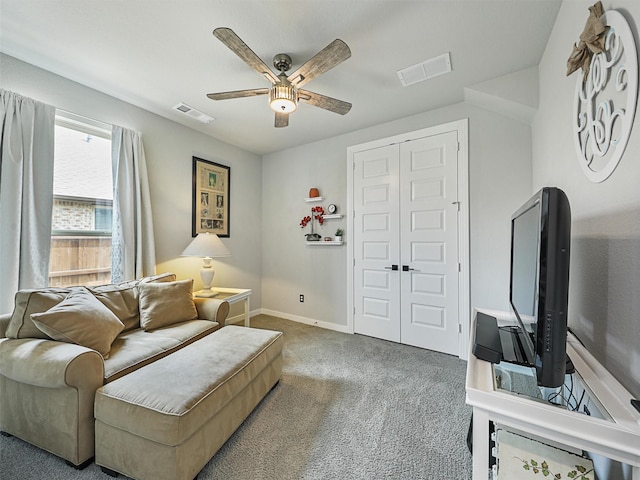 sitting room with visible vents, ceiling fan, baseboards, and carpet