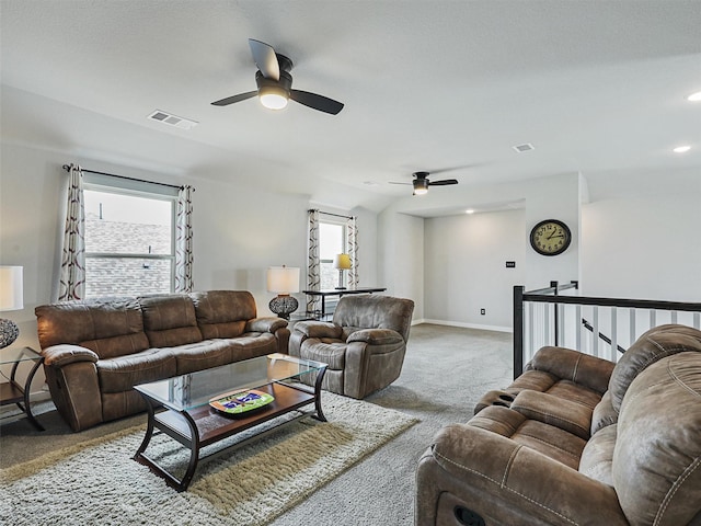 living room with visible vents, plenty of natural light, and carpet flooring