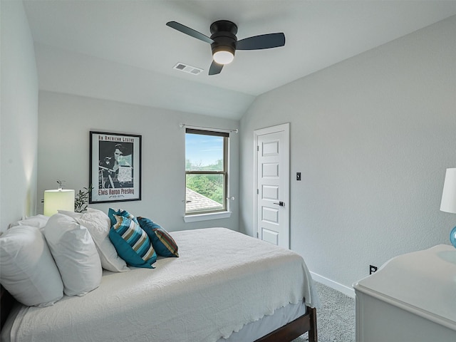 bedroom with visible vents, baseboards, vaulted ceiling, carpet floors, and a ceiling fan