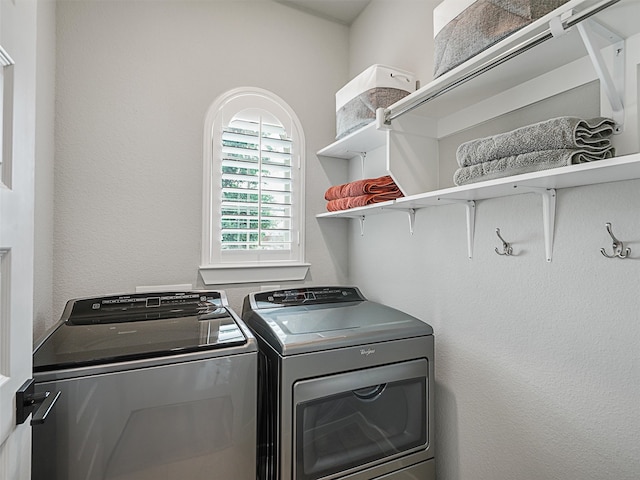 laundry room featuring washing machine and dryer and laundry area