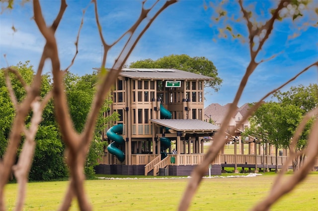 community jungle gym with a yard