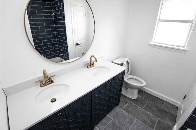 full bathroom featuring vanity, toilet, and  shower combination