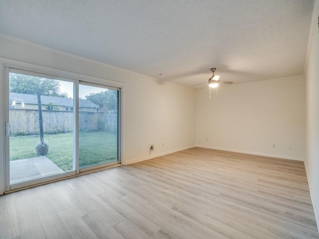 unfurnished room with a textured ceiling, ceiling fan, baseboards, and light wood-style flooring