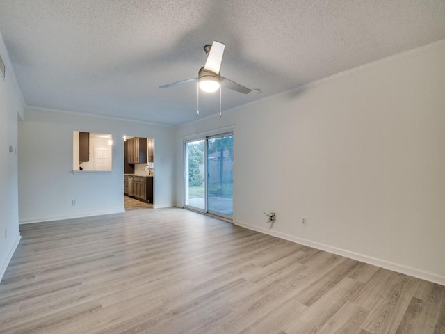 unfurnished living room featuring light wood-type flooring, ornamental molding, a textured ceiling, and ceiling fan