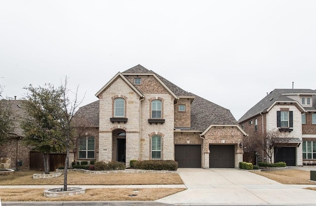 french provincial home with a garage