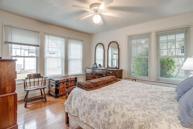 bedroom with light wood-type flooring and ceiling fan