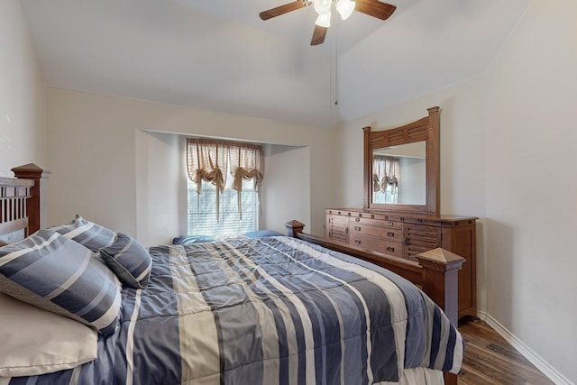 bedroom with lofted ceiling, hardwood / wood-style flooring, and ceiling fan