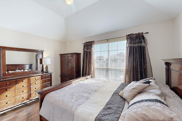 bedroom featuring lofted ceiling and dark wood-type flooring