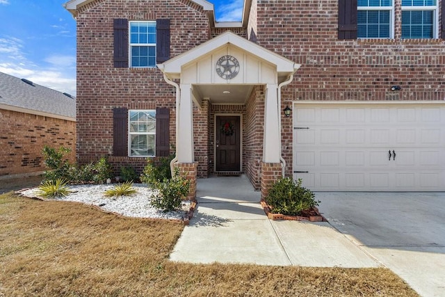 doorway to property with a garage