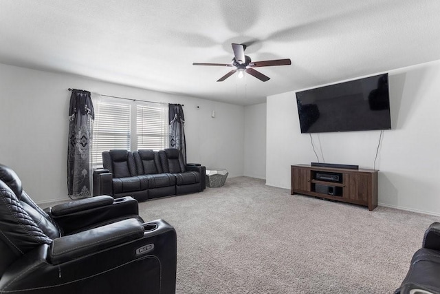 carpeted living room featuring a textured ceiling and ceiling fan