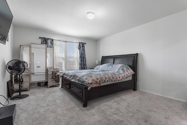 bedroom featuring light carpet