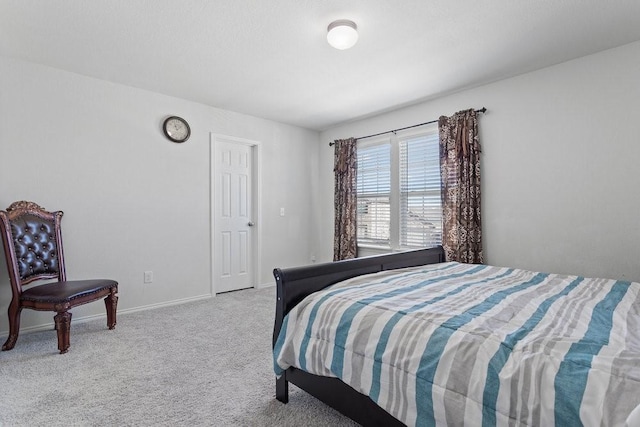 bedroom featuring light colored carpet