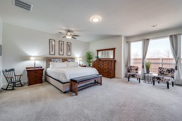 bedroom with carpet, visible vents, and baseboards