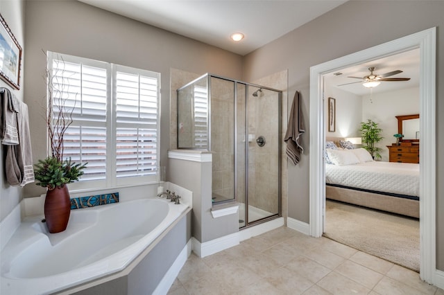 ensuite bathroom featuring a stall shower, a healthy amount of sunlight, and ensuite bathroom