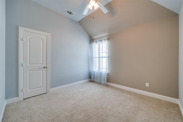 unfurnished room with carpet floors, lofted ceiling, visible vents, and ceiling fan