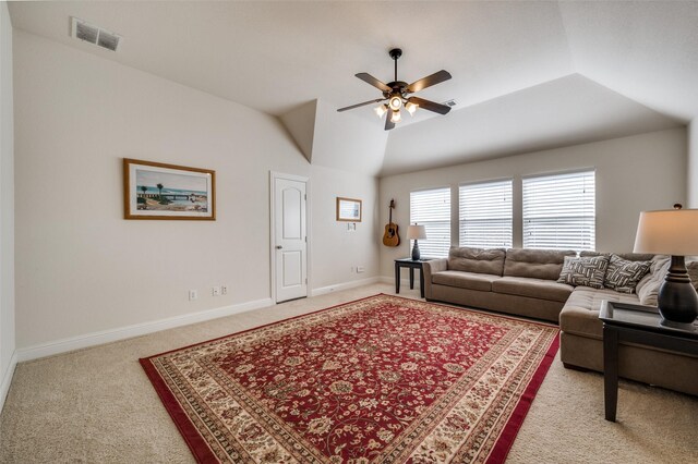 carpeted living room with vaulted ceiling and ceiling fan