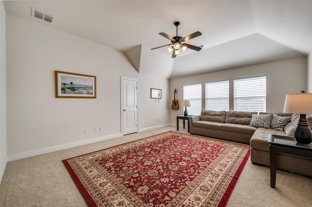 carpeted living area featuring visible vents, vaulted ceiling, baseboards, and ceiling fan