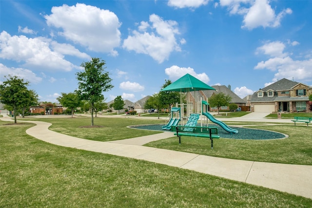 communal playground featuring a lawn