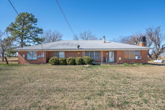 ranch-style home with cooling unit and a front yard