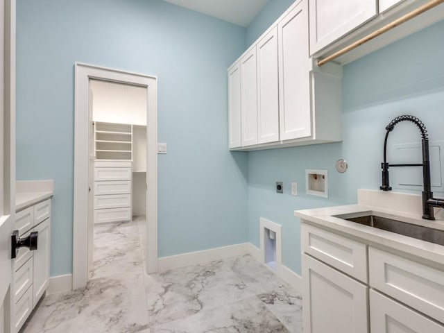 1165 Stonebridge Pass, Gunter, TX 75058 - laundry room featuring cabinet space, light marble finish floors, electric dryer hookup, and washer hookup