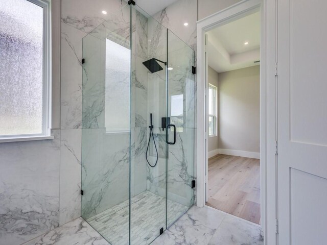 1165 Stonebridge Pass, Gunter, TX 75058 - bathroom featuring a marble finish shower, marble finish flooring, baseboards, and recessed lighting