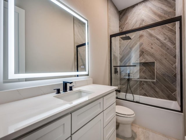 1165 Stonebridge Pass, Gunter, TX 75058 - full bathroom featuring vanity, toilet, and combined bath / shower with glass door